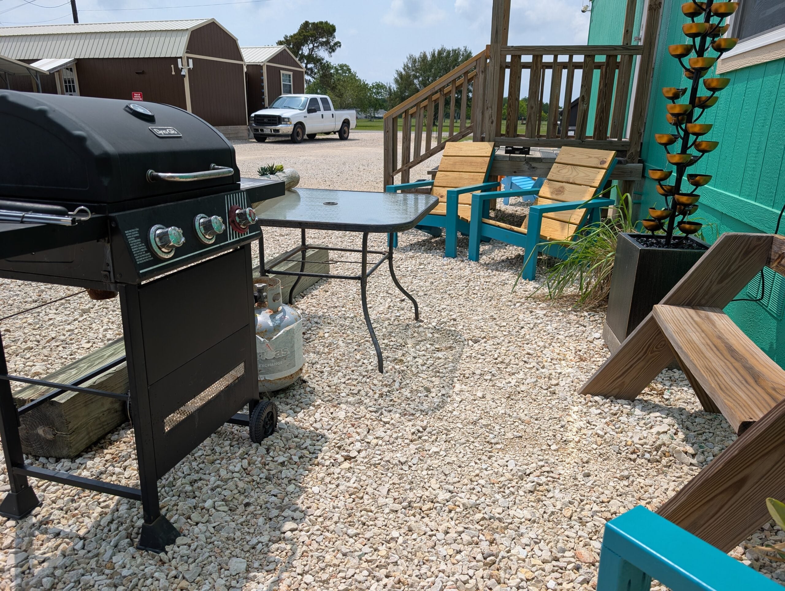 Image of Simple Stay's gas grill and outdoor seating